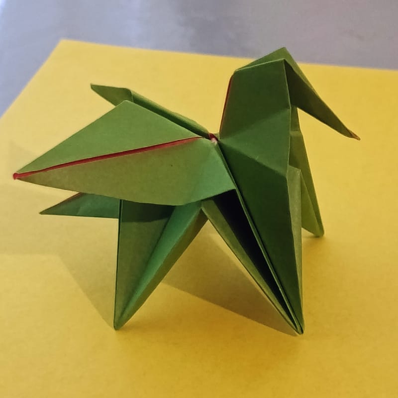 Pegasus on green paper with yellow background