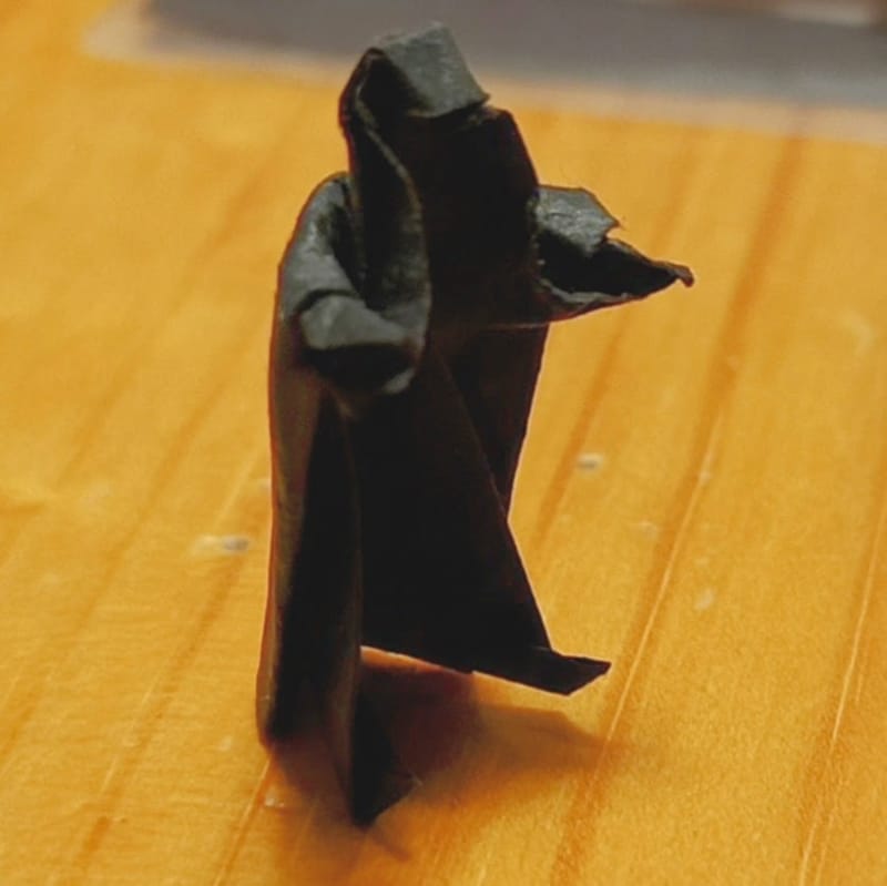 Dark figure on a table